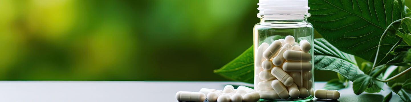 Private label supplement capsules in a clear jar next to a plant.