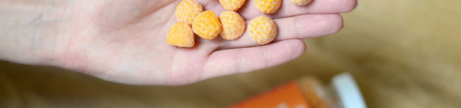 Hand holding private label gummy supplements
